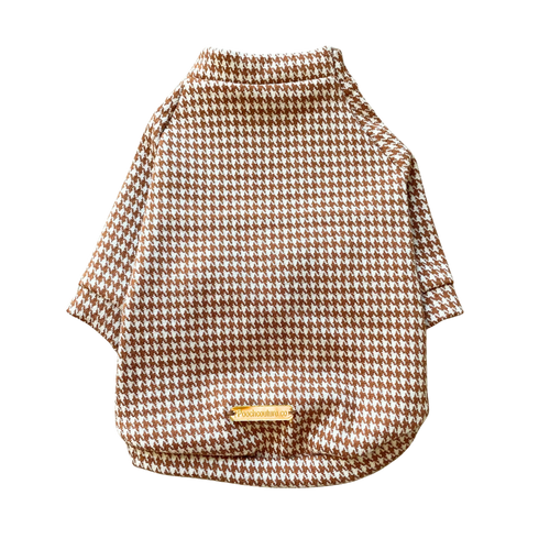 A small dog sweater with a brown and white houndstooth pattern, featuring a mock neck and short sleeves, shown on a plain white background.