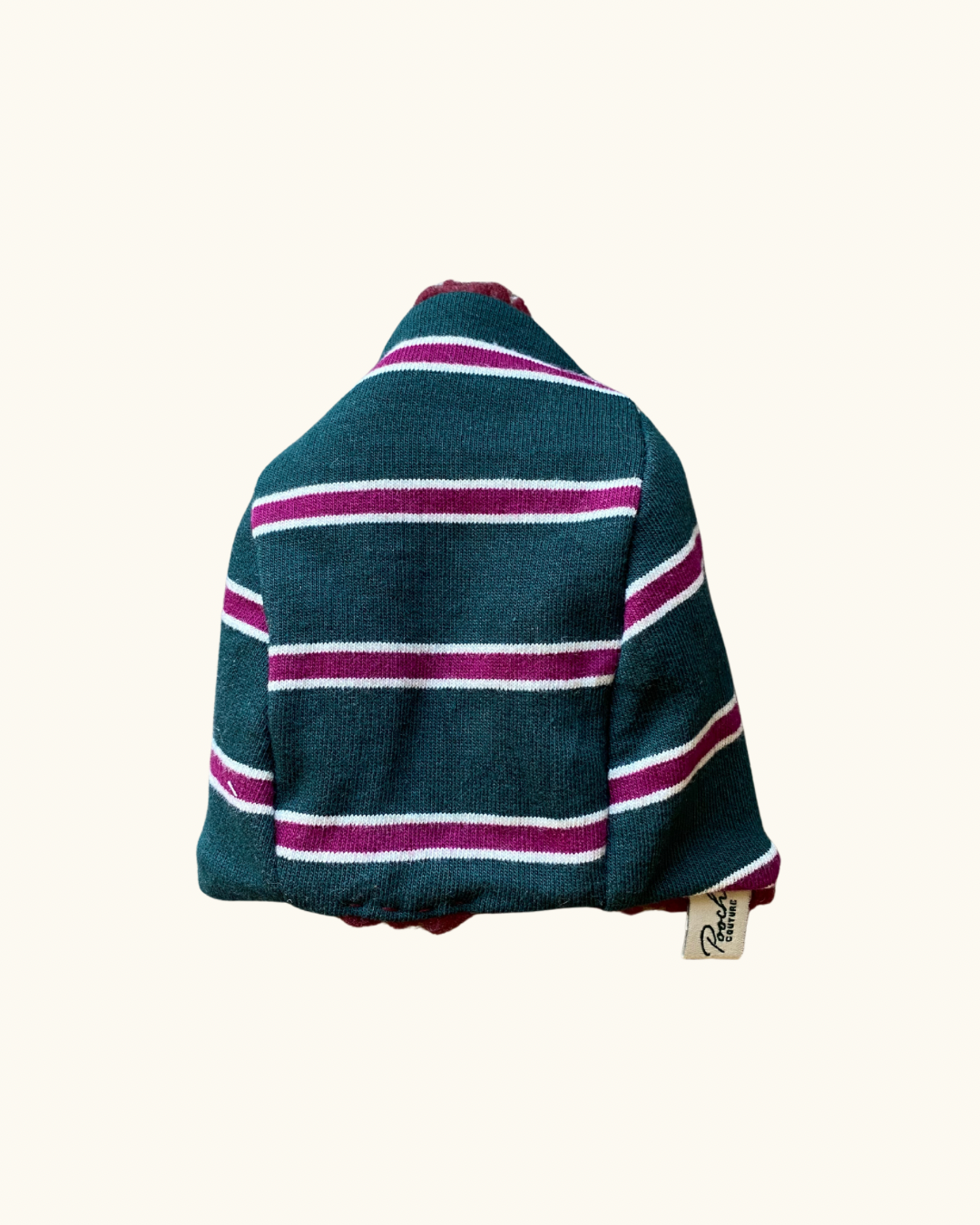 The back side of the pet snood with horizontal magenta and white stripes, displayed on a cream-colored background.